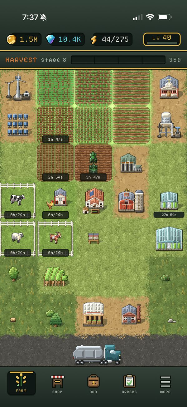 The same grid in the game, well along: fields of crops, pens with cows, sheep and goats, a greenhouse, and a tanker on the road along the bottom.