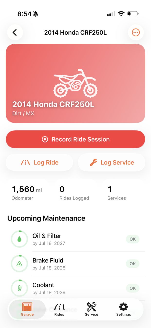 The detail page for a 2014 Honda CRF250L: 1,560 mi on the odometer, buttons to record a ride, log a ride or log service, and the upcoming maintenance list.